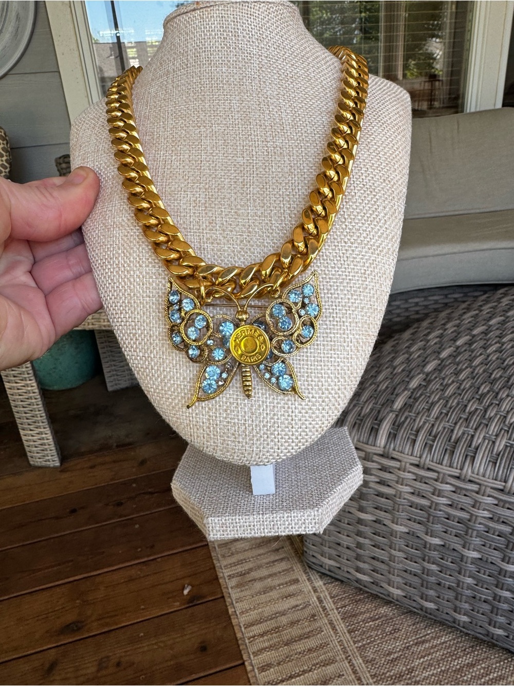 Gold-Tone Butterfly Pendant Necklace with Light Blue Crystals and logo